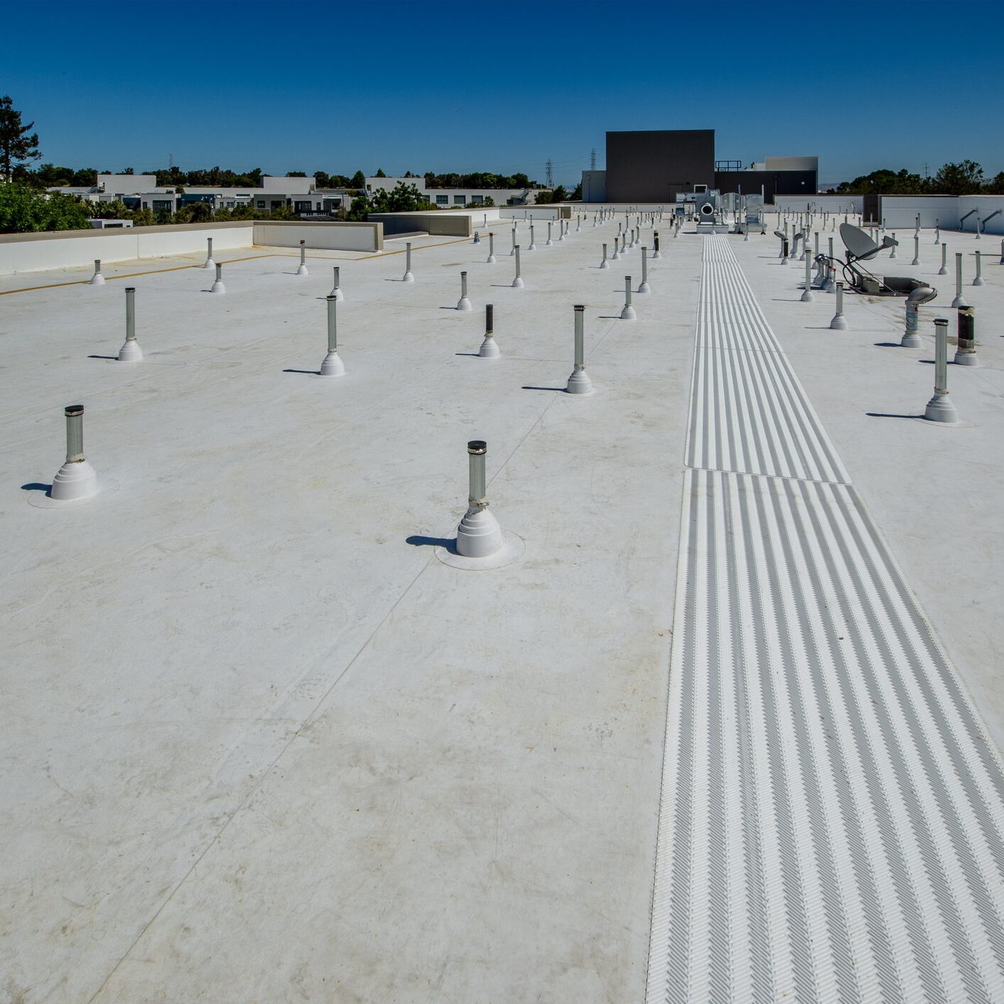 Membrane flat roof for an apartment complex.