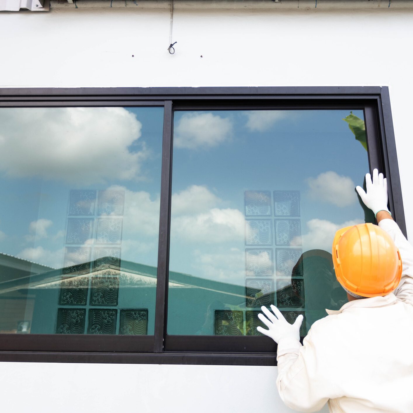 The glazier is about to install an aluminum-glass window.